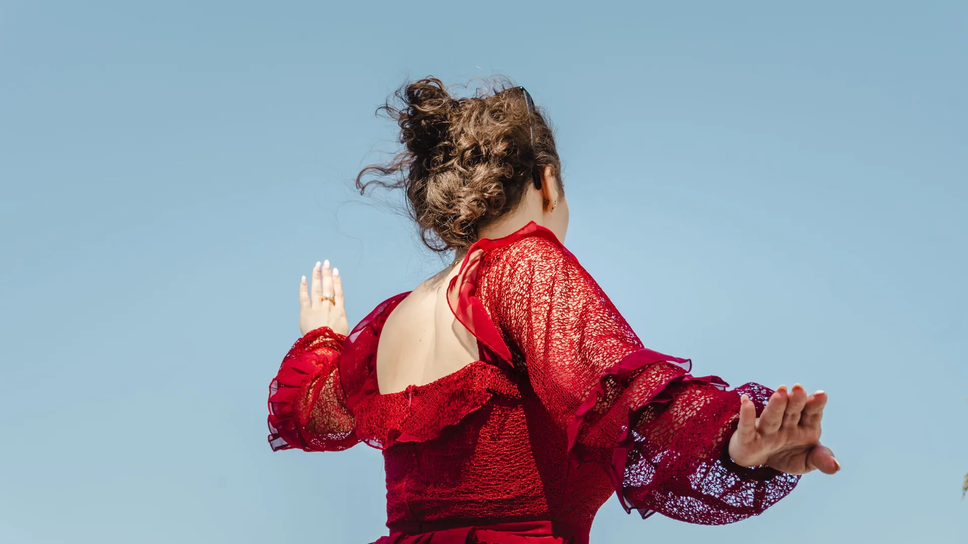 Flamenco performers dancing in a whitewashed cave in Sacromonte, Granada